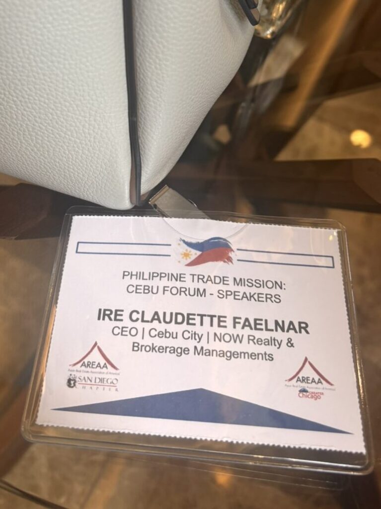 A close-up of Ire Claudette Faelnar's official name badge, identifying her as the CEO of NOW Realty & Brokerage Managements.