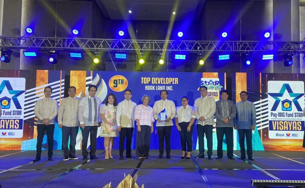 RDAK Land Inc. (Bayanihan Flats) team accepting the Pag-IBIG Fund Top 9 Developer award on stage in Cebu City.